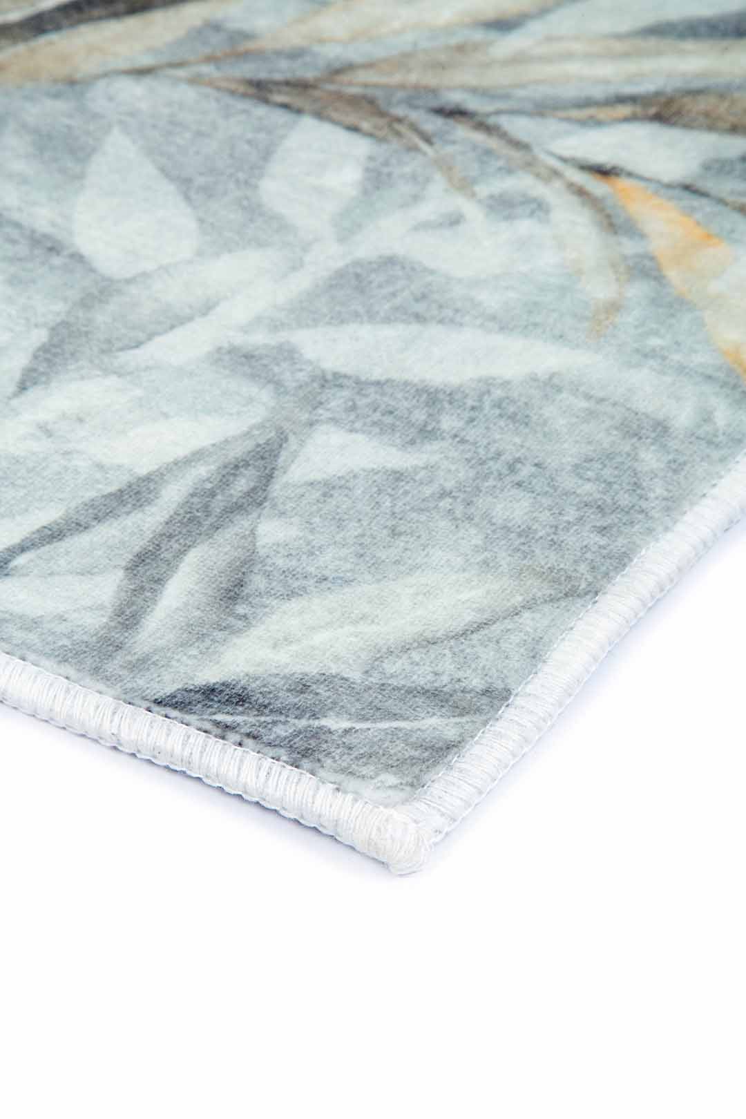 Trópusi Árnyak – Elegáns Levélmintás Szőnyeg